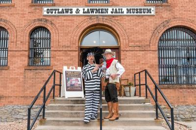 people standing in front of jail museum